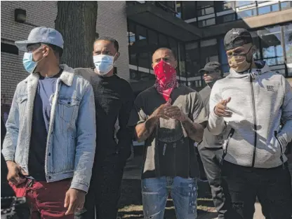  ?? PAT NABONG/SUN-TIMES ?? Chance the Rapper (from left), G Herbo, Vic Mensa and Joey Purp chat before speaking to the media outside Overton Elementary School in Bronzevill­e during a peace walk and back-to-school event on Saturday.