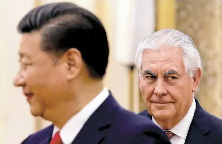  ?? Thomas Peter/Pool Photo via AP ?? China’s President Xi Jinping, left, stands near U.S. State of Secretary Rex Tillerson during a meeting at the Great Hall of the People in Beijing on Sunday.