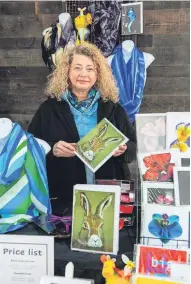  ?? ?? Eyecatchin­g Designer Patricia Moon shows off what’s on sale at her stall