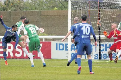  ?? PICTURE: Richard Birch ?? Henry Jones (blue - far left) puts Bangor City into the lead against TNS