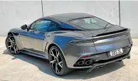  ??  ?? No wings needed. The DBS’s clever aerodynami­cs produce up to 180kg of downforce by channeling the air flow through the body.