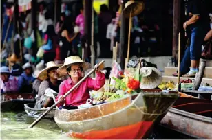  ??  ?? Local delights: Visit Pattaya floating market, Chon Buri, where the locals peddle their goods