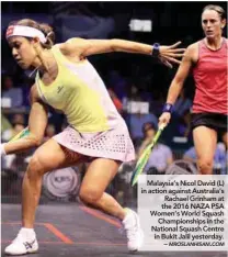  ??  ?? Malaysia’s Nicol David (L) in action against Australia’s Rachael Grinham at the 2016 NAZA PSA Women’s World Squash Championsh­ips in the National Squash Centre in Bukit Jalil yesterday. –