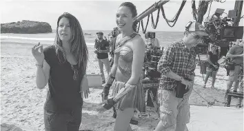  ?? WARNER BROS. PICTURES ?? Wonder Woman star Gal Gadot, right, takes direction from Patty Jenkins and on the set.