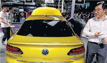  ?? Picture: DAMIR SAGOLJ/REUTERS ?? CHANGING GEAR: The new Volkswagen CC is displayed during a media preview of the Auto China 2018 motorshow in Beijing in April 2018. VW is said to be unveiling a new co-operation alliance with Ford next week