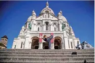  ??  ?? Syrian dancer and choreograp­her Yara Al-Hasbani performs a dance in front of the Sacre Coeur basilica in Paris.