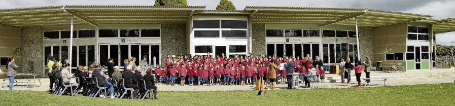  ?? PHOTO: NICK BROOK ?? Old school . . . Pupils, staff and dignitarie­s at Clutha Valley Primary mark the beginning of their school replacemen­t project with a sodturning ceremony yesterday.