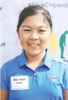  ??  ?? Anna Huang’s smile reflects her first overall finish in the girls 10-11 competitio­n, during The Drive, Chip and Putt Championsh­ip in Washington state last September.