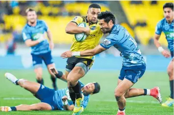  ?? Photos / Getty Images, Photosport ?? The Warriors were flogged by an inexperien­ced Panthers side, while the Blues could not contain Ngani Laumape and the Hurricanes.