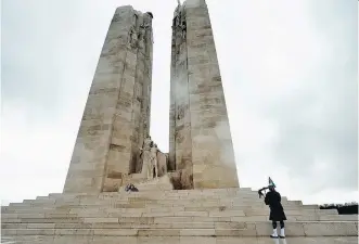  ?? GETTY IMAGES/ FILES ?? An RCAF piper plays at the Canadian memorial in Vimy, France. Canada’s 1917 victory has been memorializ­ed and mythologiz­ed in our history textbooks and Remembranc­e Day ceremonies.