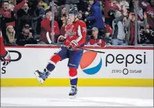  ?? [ALEX BRANDON/THE ASSOCIATED PRESS] ?? Washington’s John Carlson celebrates his goal during Saturday’s game against New Jersey.