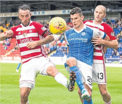  ?? Picture: SNS Group. ?? Graham Cummins battles with Hamilton pair Dougie Imrie and Alex Gogic.