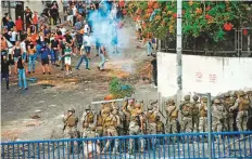  ?? AFP ?? ■ Lebanese soldiers fire rubber-bullet at protesters following Sa’ad Hariri’s resignatio­n on Thursday after a row with Aoun.