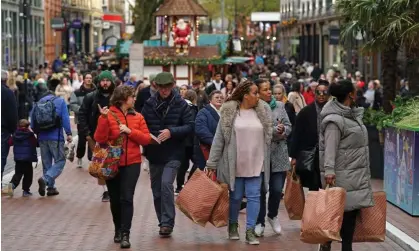  ?? ?? Shoppers on New Street in Birmingham. Minority ethnic people make up 51.4% of the population in the UK’s second largest city, where 20 years ago seven out of 10 people were white. Photograph: Jacob King/PA