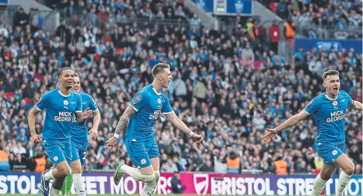  ?? ?? Harrison celebrates scoring at Wembley. Photo: Joe Dent