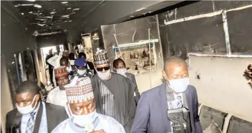  ??  ?? Borno State Governor, Prof. Babagana Umara Zulum (2nd right), assesses yesterday the destructio­n carried out by Boko Haram members on the recently rehabilita­ted General Hospital Magumeri, in Borno State