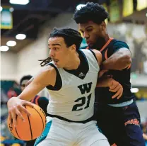  ?? FREELANCE
PETER CASEY/ ?? Woodside’s Silas Barksdale drives to the basket against Maury’s Tyler Bell during the Class 5 Region B championsh­ip game Friday night at Echols Hall in Norfolk. Barksdale finished with a game-high 14 points.