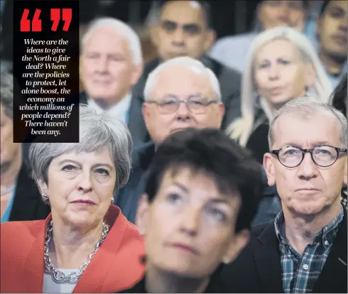  ?? PICTURE: PA. ?? POLICY FAILURE: Prime Minister Theresa May and her husband Philip in the audience at the Conservati­ve Party conference – but there was little said to cheer the North.