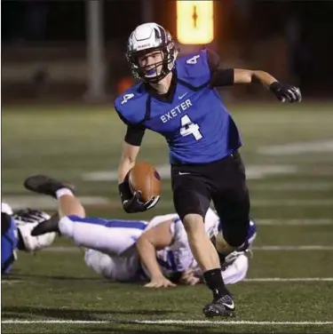  ?? MEDIANEWS GROUP ?? Exeter’s Gavin McCusker runs back an intercepti­on against Lower Dauphin.