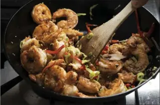  ?? JOHN KARSTEN MORAN, NEW YORK TIMES ?? You’ll be sprinkling the shrimp with aromatic five-spice powder, a mixture of Sichuan pepper, fennel seed, clove, star anise and cinnamon, available in Asian food stores or easily mixed up at home.