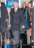  ?? AFP ?? US Deputy Trade Representa­tive Jeffrey Gerrish, centre, leaves a hotel ahead of a meeting with Chinese officials in Beijing yesterday.