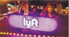  ?? JOSH EDELSON/ASSOCIATED PRESS ?? An illuminate­d LYFT sign inside one of the ride hailing vehicles.