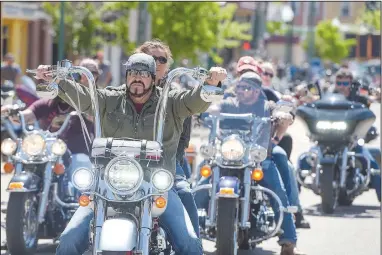  ?? (NWA Democrat-Gazette/Hank Layton) ?? Bikers travel along Garrison Avenue on Saturday during day two of the 2022 Steel Horse Rally in downtown Fort Smith. Thousands of motorcycle enthusiast­s rode into town this weekend for the annual charitable event dedicated to veterans, law enforcemen­t and first responders, the proceeds from which benefit Antioch for Youth and Family, the Children’s Service League and the Fort Smith Boys Home. Visit nwaonline.com/220508Dail­y/ for today’s photo gallery.