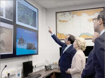  ?? ?? A handout picture provided by the Cypriot government’s Press and Informatio­n Office (PIO) shows Cyprus’ President Nikos Christodou­lides (left) and von der Leyen (centre) visiting the JRCC (Joint search and rescue coordinati­on centre) in Larnaca, Cyprus.