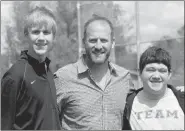  ?? LYNN KUTTER ENTERPRISE-LEADER ?? Farmington’s Jeremy Mueller (left) and Prairie Grove’s McKay Gregson were honored for sportsmans­hip during a U.S. 62 rivalry basketball game in February by retired major league pitcher Ryan Dempster prior to the start of the 4A-1 District baseball...