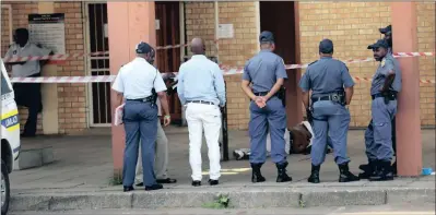  ?? PICTURE: NQOBILE MBONAMBI ?? The body of Sipho Ndovela lies outside the uMlazi Magistrate’s Court, where he was shot dead.