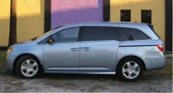  ?? MARK TOLJAGIC PHOTOS FOR THE TORONTO STAR ?? Honda’s fourth-generation Odyssey was roomier then ever, with room for three adults in both back rows.