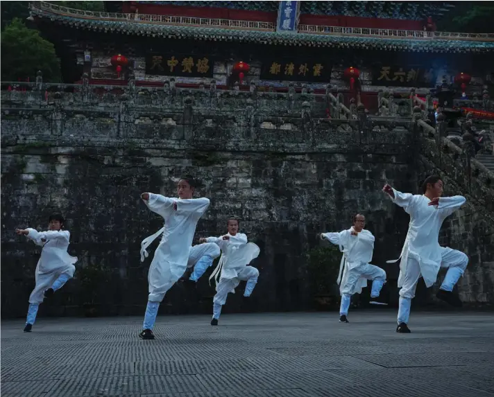  ?? ?? Taoists perform Wudang Tai Chi at Zixiao Palace during a media organized tour at Wudangshan Mountain in central China's Hubei Province on Thursday, May 11, 2023. Wudangshan is famed for its religious history as one of the centers for Taoism, Tai Chi exercise and Taoist fighting styles. Photo : AP/Andy Wong.