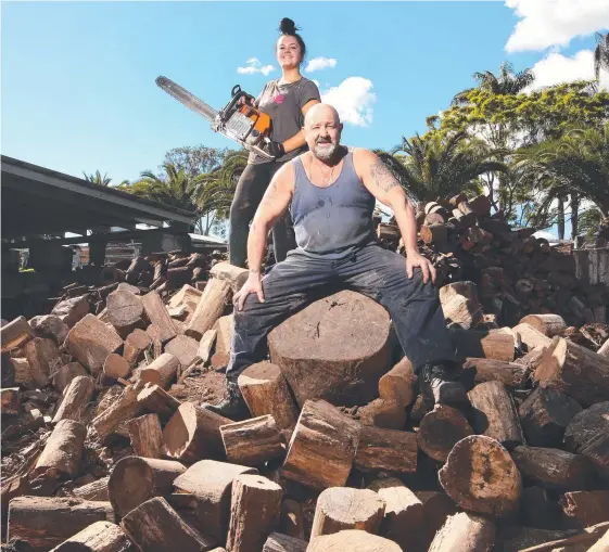  ?? Picture: GLENN HAMPSON ?? Phil Regan with his daughter Sylvia, who works alongside him in his booming Gold Coast firewood business.