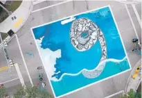  ??  ?? Drivers traveling along Killian Drive will see the exhibit called “Elevation Drive,” which will have four street murals capturing rising sea levels.