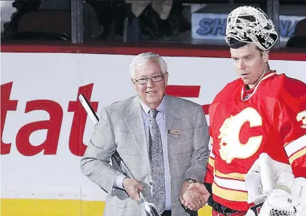  ?? PHOTOS: FILES ?? Clay Riddell, here with Miikka Kiprusoff, became a co-owner of the Flames in 2003 out of a desire to provide the local team stability.