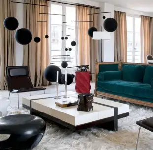  ??  ?? LEFT TO RIGHT The owner of this apartment in the Faubourg Saint-antoine district of Paris displays a selection of Hervé Van der Straeten’s pieces, including his Capsule footstools, Chinoise lamp and Trace side tables