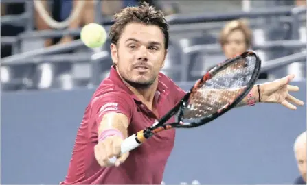  ?? PICTURE: REUTERS ?? BACK-HANDED: Stan Wawrinka returns during his second round win over Alessandro Giannessi at Flushing Meadows yesterday.