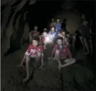  ?? THAM LUANG RESCUE OPERATION CENTER VIA AP ?? This Monday, July 2, 2018, photo released by Tham Luang Rescue Operation Center, shows the boys and their soccer coach as they were found in a partially flooded cave, in Mae Sai, Chiang Rai, Thailand. The 12 boys and coach found after 10 days are...