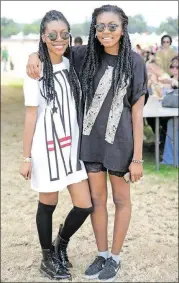  ?? PHAN/AMERICAN-STATESMAN. TINA ?? Good footwear is key at an all-day, outdoor event. In 2013, sisters Alex Powell and Amyre Powell of Dallas found the dream combinatio­n of comfortabl­e and cute. They said they unintentio­nally coordinate­d outfits that day.