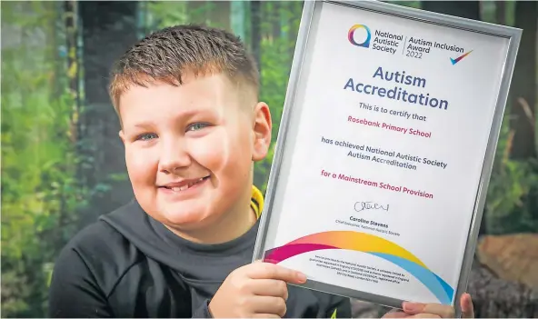  ?? ?? NATIONAL LEADER: Ethan Hastie of Rosebank Primary with Scotland’s first Autism Inclusion Award for the school. Picture by Mhairi Edwards.