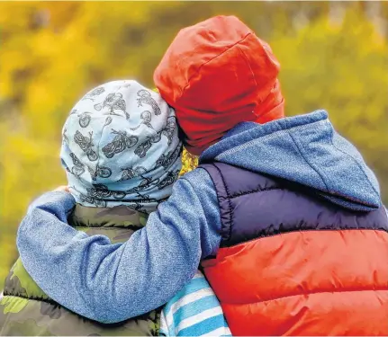  ??  ?? Kara Hebb’s sons show off their beloved slouchie beanies from her online clothing business, Saelvage. Just because shopping may have slowed or stopped during the lockdown, doesn’t mean kids have stopped growing.