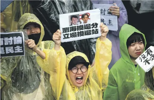  ?? PHOTOGRAPH: YASUYOSHI CHIBA/AFP VIA GETTY IMAGES ?? Protesters rally against opposition parties’ plans for a bill to give Taiwan’s MPs extraordin­ary powers