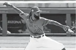  ?? ROB SCHUMACHER/THE REPUBLIC ?? Diamondbac­ks relief pitcher Miguel Castro throws to the Texas Rangers in the fifth inning at Salt River Fields on March 8.