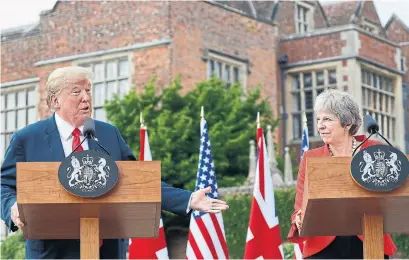  ?? PABLO MARTINEZ MONSIVAIS/THE ASSOCIATED PRESS ?? U.S. President Donald Trump told reporters that Theresa May was an “incredible woman” who is “doing a fantastic job.”