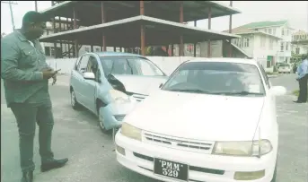  ??  ?? This blue Spacio was heading south on East Street yesterday midday when it collided with the driver’s side of this white Carina which was heading west on Quamina Street. No one was hurt but both vehicles were badly damaged.