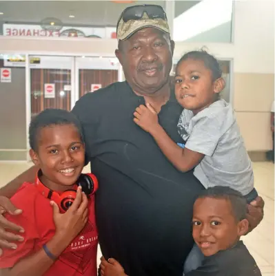  ?? Photo: Waisea Nasokia ?? Corporal Isei Navugavuga with his grandchild­ren Siteri Salaivalu, Eseroma Nabuka and Merewalesi Lewaquto at the Nadi Internatio­nal Airport on July 22, 2019.