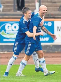  ??  ?? Paul McManus celebrates scoring Cove’s third goal