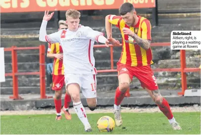  ??  ?? Sidelined Aitken, right, is playing a waiting game at Rovers