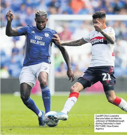  ??  ?? Cardiff City’s Leandro Bacuna takes on Marvin Johnson of Middlesbro­ugh during Saturday’s clash PICTURE: Huw Evans Agency