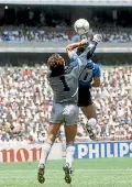  ??  ?? Diego Maradona scores his infamous ‘Hand of God’ goal in 1986, but video referees would have disallowed it.